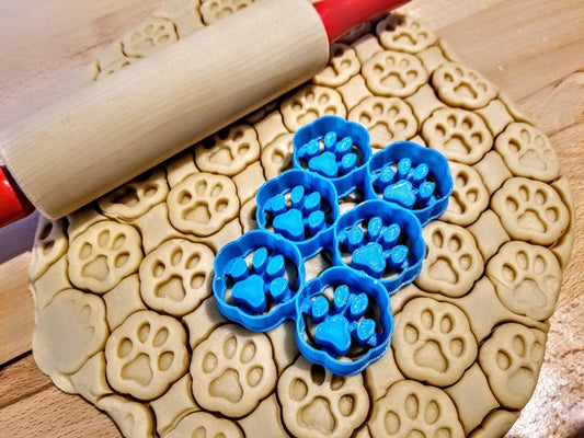 Dog paw shaped multi treat cutter to make home made dog biscuits